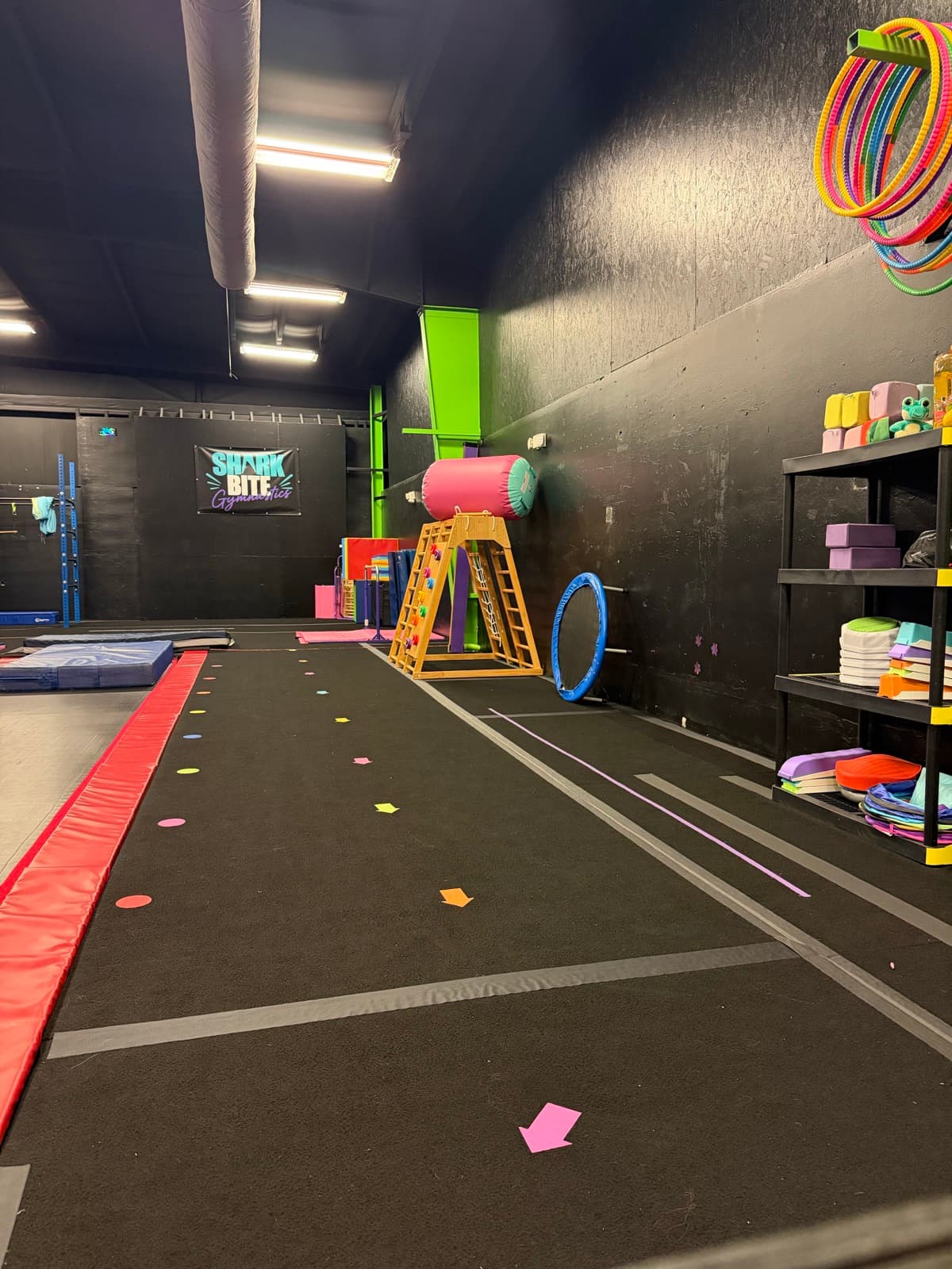 The gymnastics floor set up with hoops and the wedge mat
